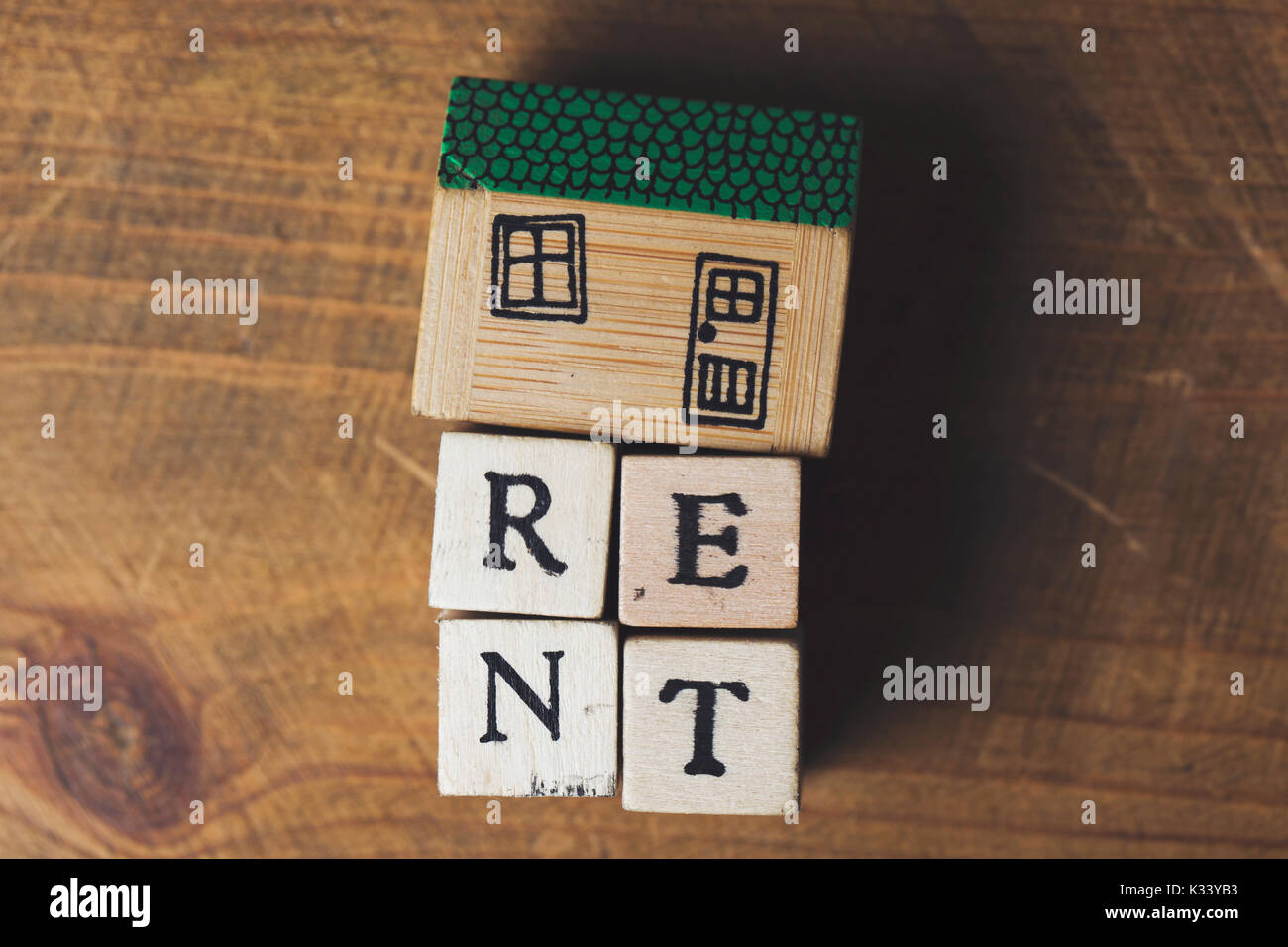 Home rent concept. House model with rent word made from wooden blocks ...