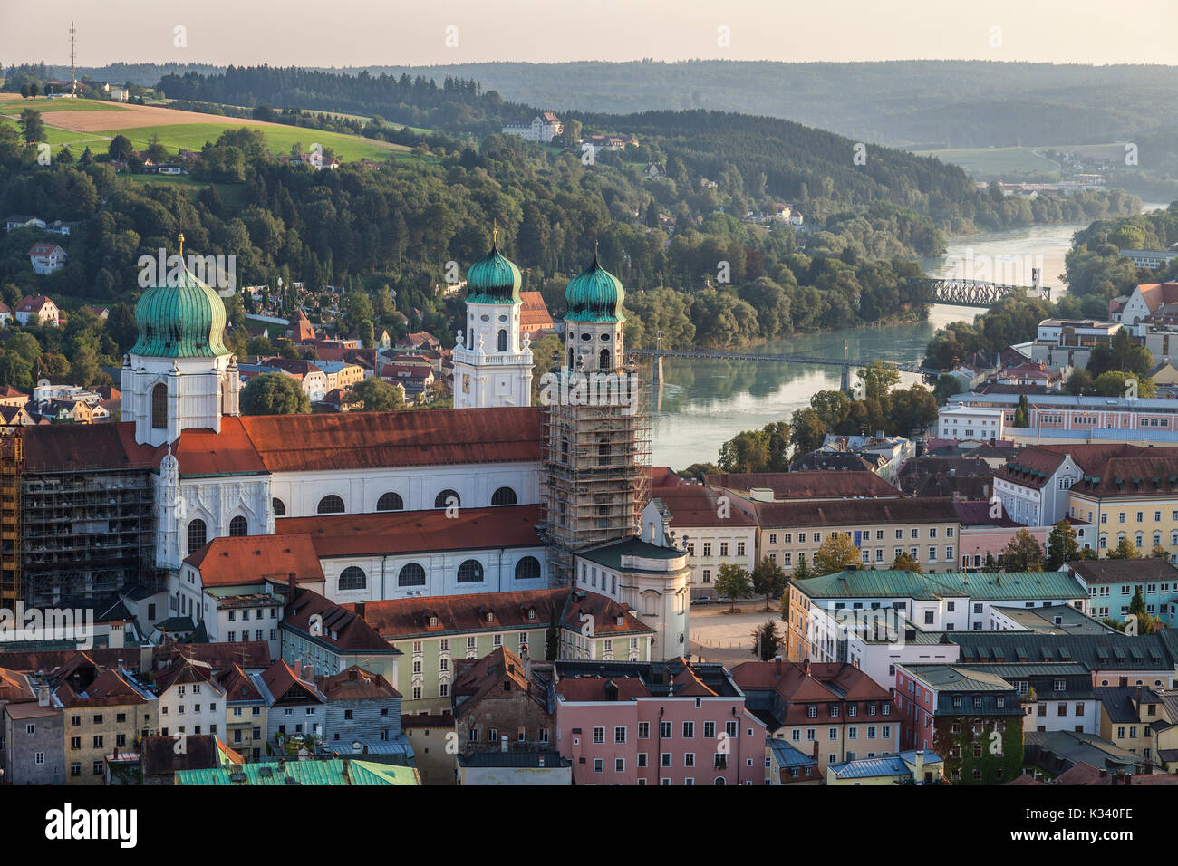 Top view of the typical church and houses set among green hills and river Passau Lower Bavaria Germany Europe Stock Photo
