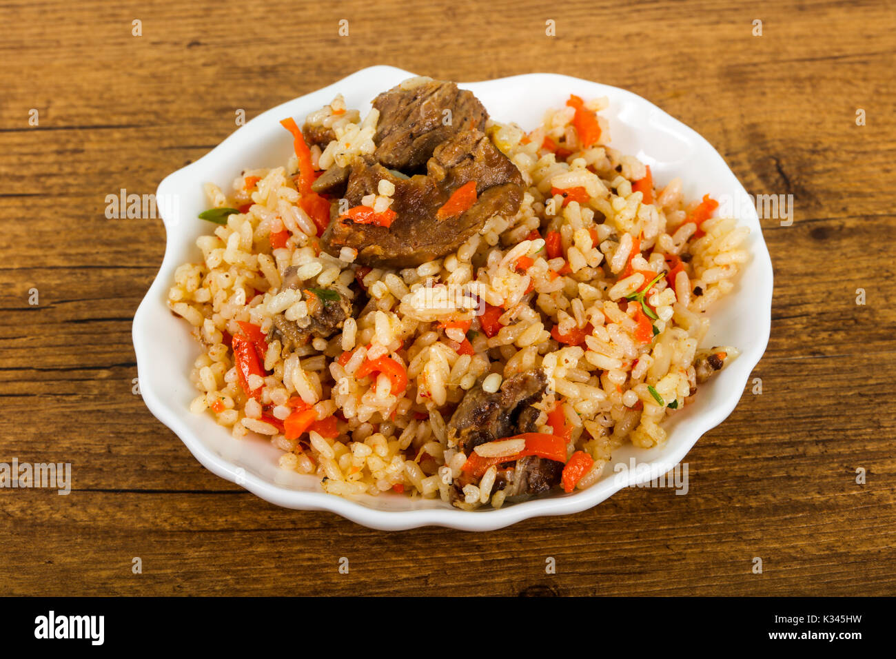 Asian rice - Plov with meat and carrot Stock Photo - Alamy