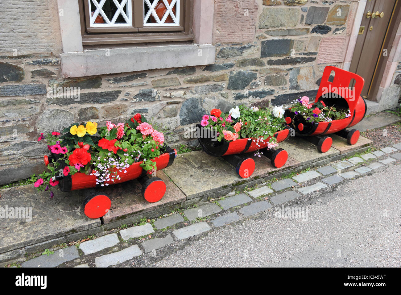 Planters in form of a train and carriages. Stock Photo
