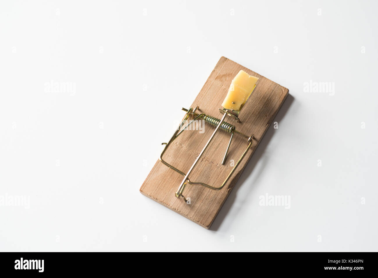 Mouse trap with cheese isolated on white, top view Stock Photo