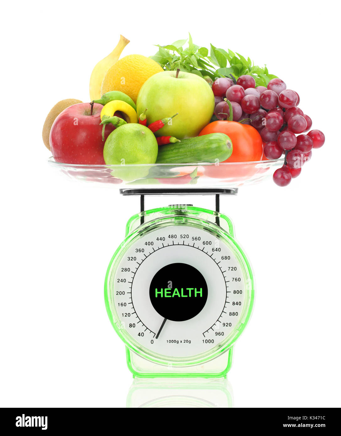 Healthy eating. Kitchen scale with fruits and vegetables Stock Photo