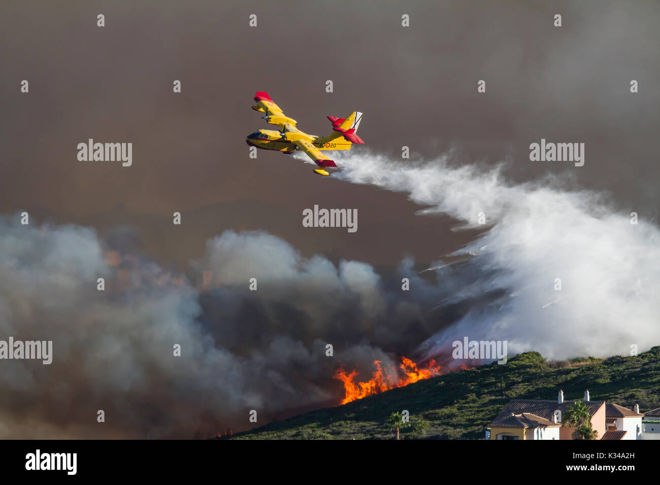 Fire Fighting Aircraft attacking wild fire in southern Spain Stock