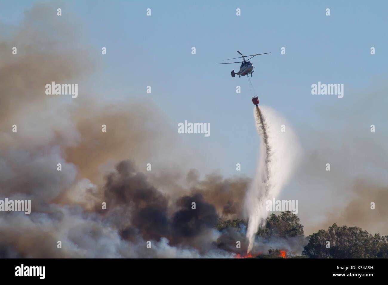 Fire Fighting Aircraft attacking wild fire in southern Spain Stock