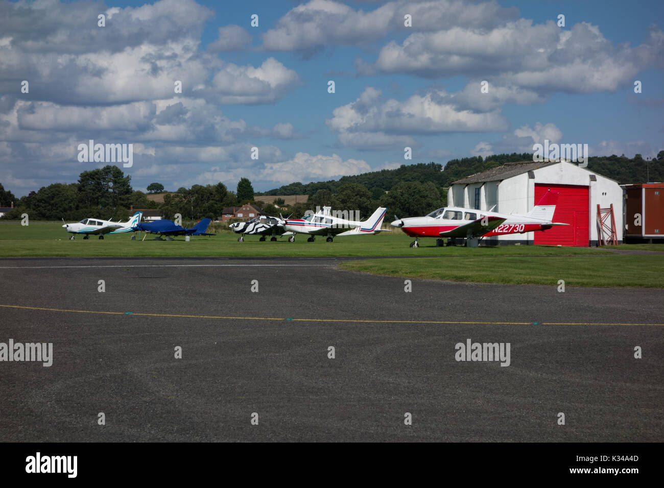 Light aircraft parked near buildings. Wolverhampton Halfpenny Green Airport. South Staffordshire. UK Stock Photo