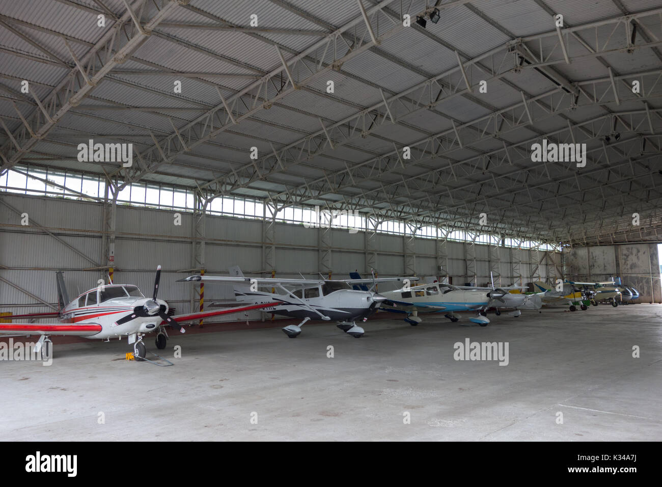 Aircraft Hanger with light aircraft. Wolverhampton Halfpenny Green Airport. UK Stock Photo