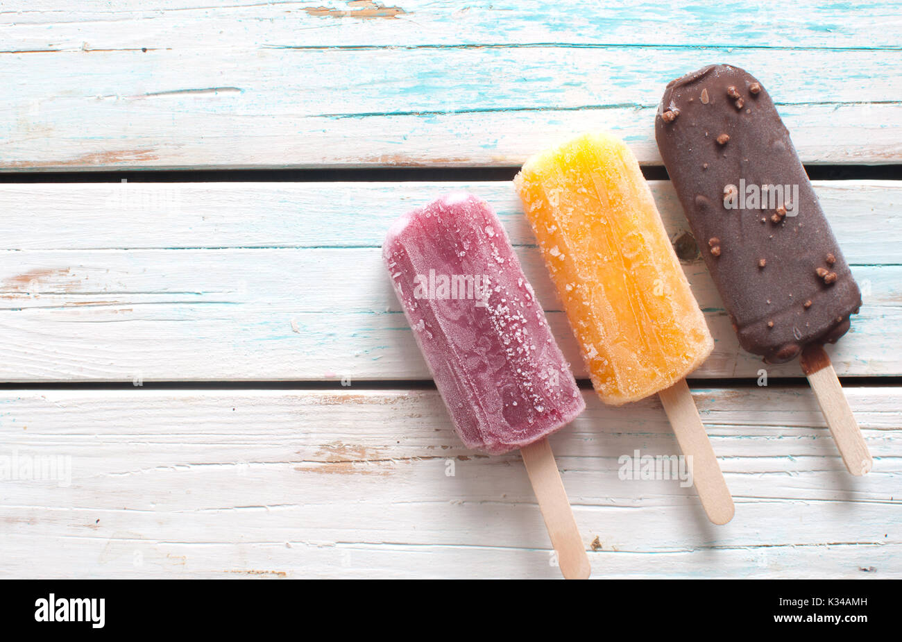 assorted-flavored-ice-lollies-over-a-wooden-background-stock-photo-alamy