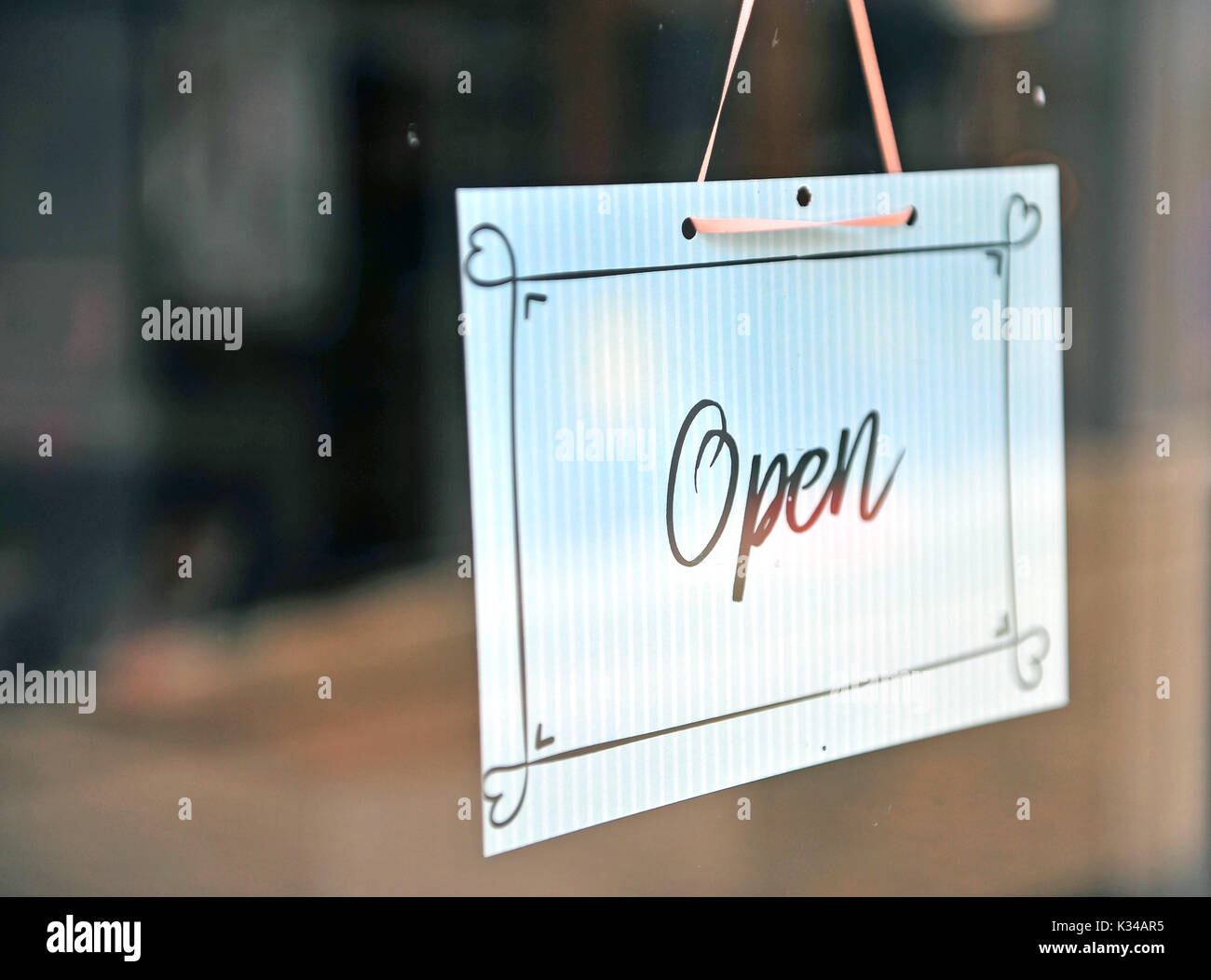 Black and white hanging open sign on the glass Stock Photo - Alamy