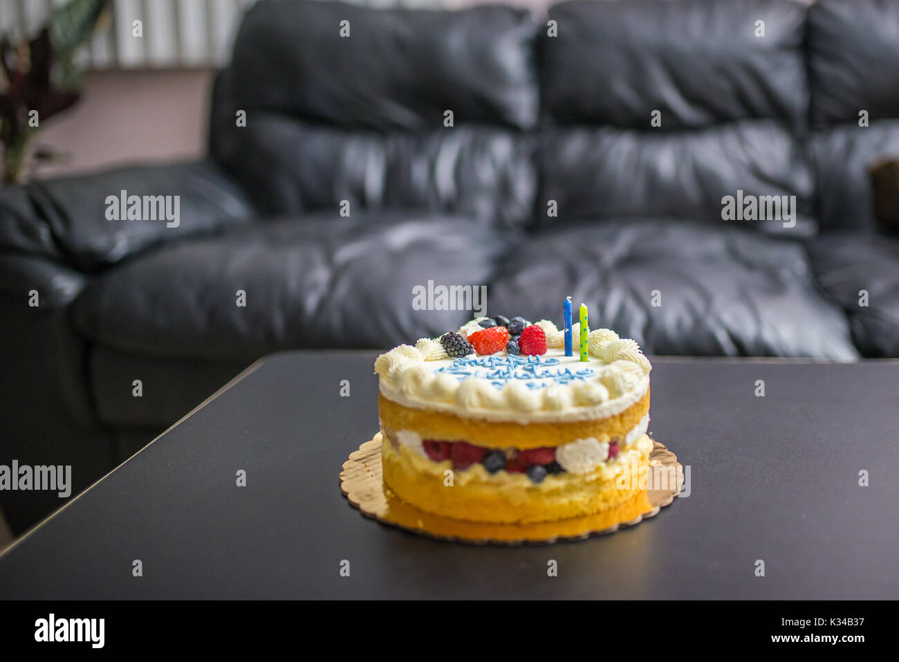 Birthday cake with two candles Stock Photo Alamy