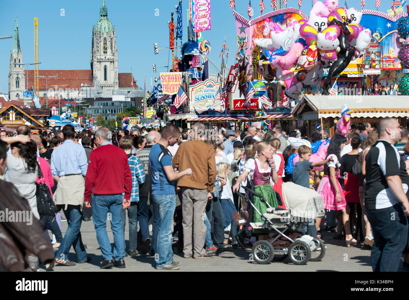 Oktoberfest in Munich is the biggest beer and folk festival in the world.with many thousands visitors every day, now walking over funfair Stock Photo