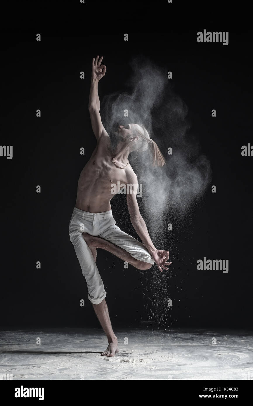 Young man practicing yoga on white background Stock Photo