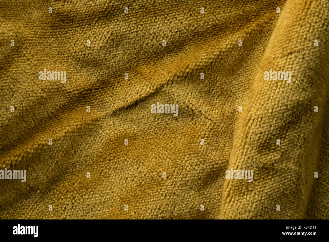 Expensive golden angora goat velour fabric mixed with silk fibers