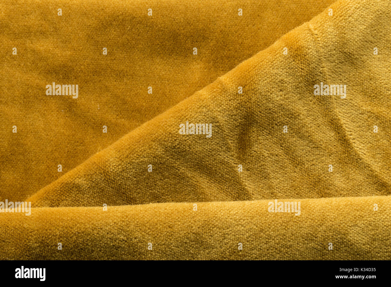 Expensive golden angora goat velour fabric mixed with silk fibers