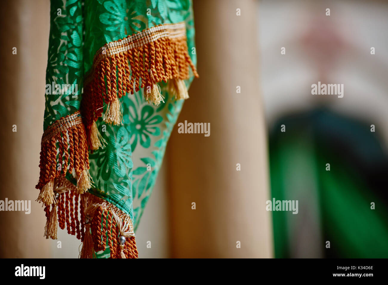 Textile decorations hanging inside Indian temple macro Stock Photo - Alamy