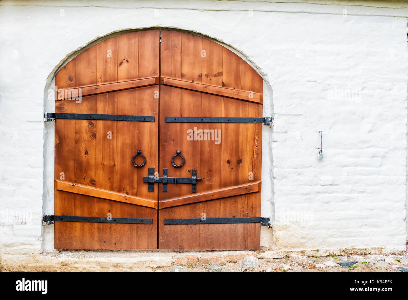 wooden gates closed on the bolt Stock Photo
