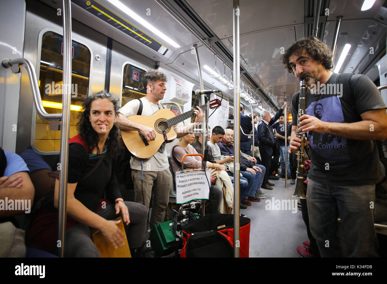 LINE D, BUENOS AIRES, ARGENTINA - SEPTEMBER 2017 - A band called â€˜â€™Rumbo Subterraneoâ€™â€™ plays in the subway train for money. Unidentified peopl Stock Photo