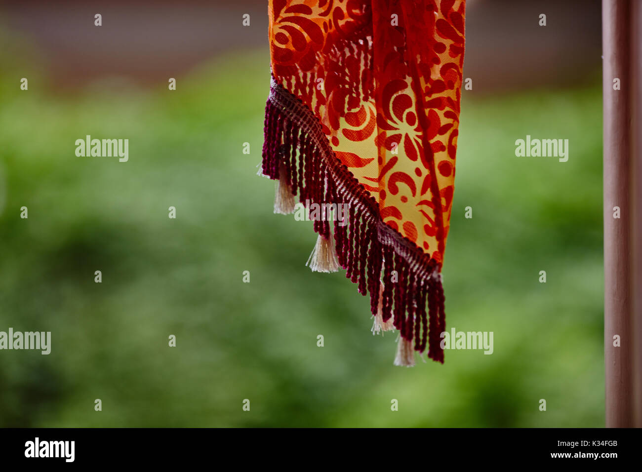 Textile decorations hanging inside Indian temple macro Stock Photo - Alamy