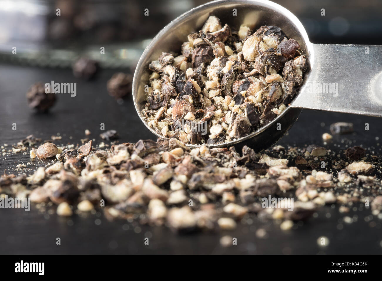 Ground Black Pepper Spilling from Teaspoon Stock Photo Alamy