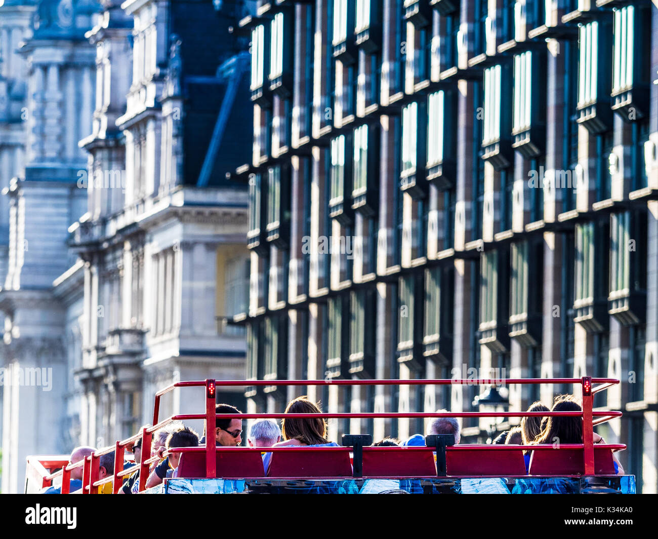 London Tourism - Tourists on an open topped tour bus in central London UK Stock Photo
