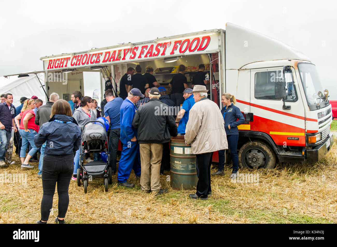 People queue at a fast food truck at Ford 100 Fest in Ballinascarthy, West Cork, Ireland. Stock Photo