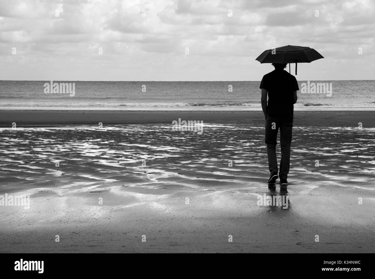 wet beach walk in black and white Stock Photo