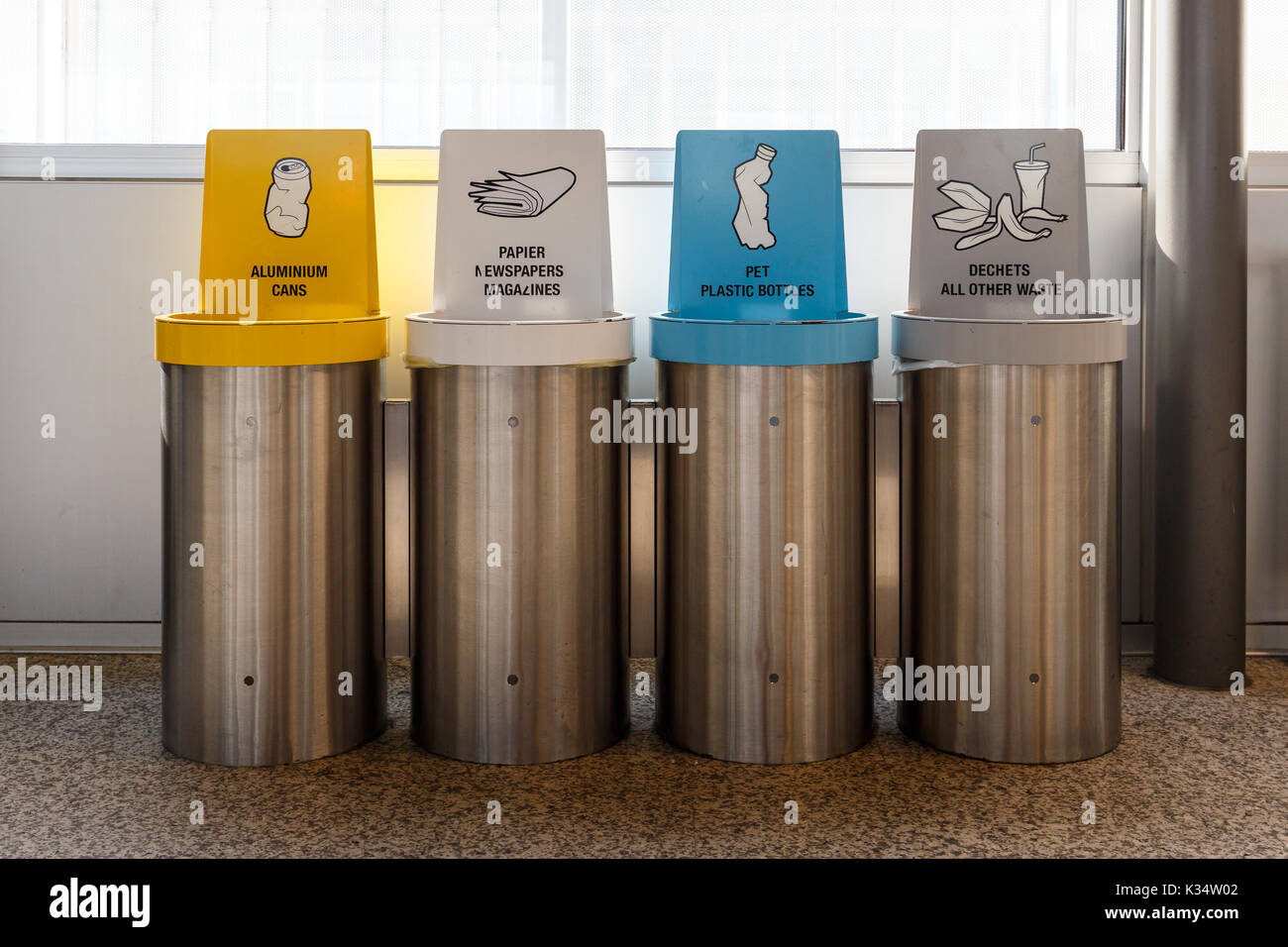 Recycle bins in airport terminal Stock Photo Alamy
