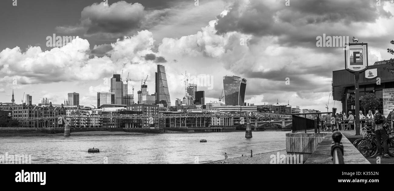 Panoramic view from the Founders Arms on the South Bank of the River Thames of the iconic modern skyscrapers in the City of London financial district Stock Photo
