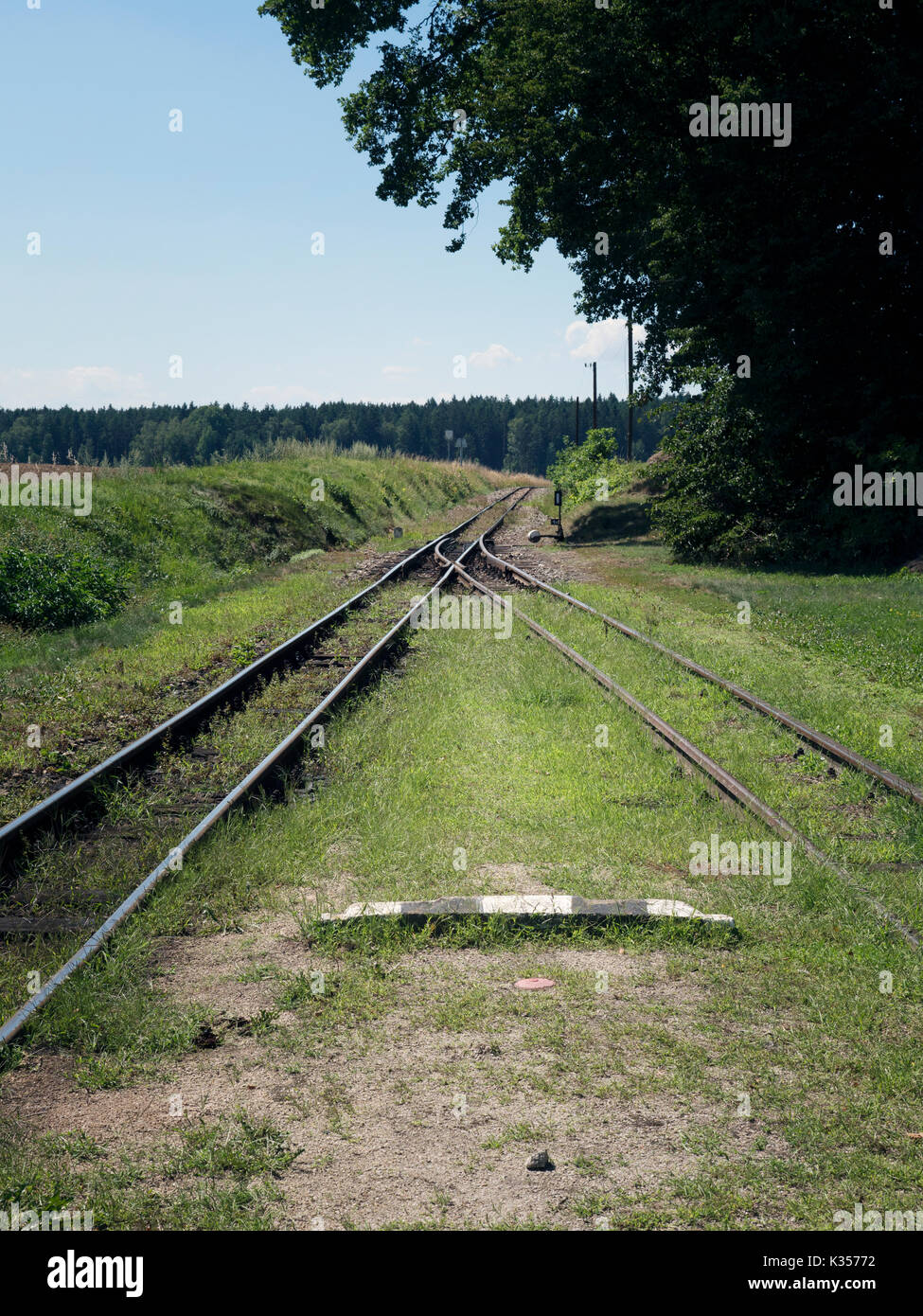 Small train station on narrowgauge. Sunshine weather, village train