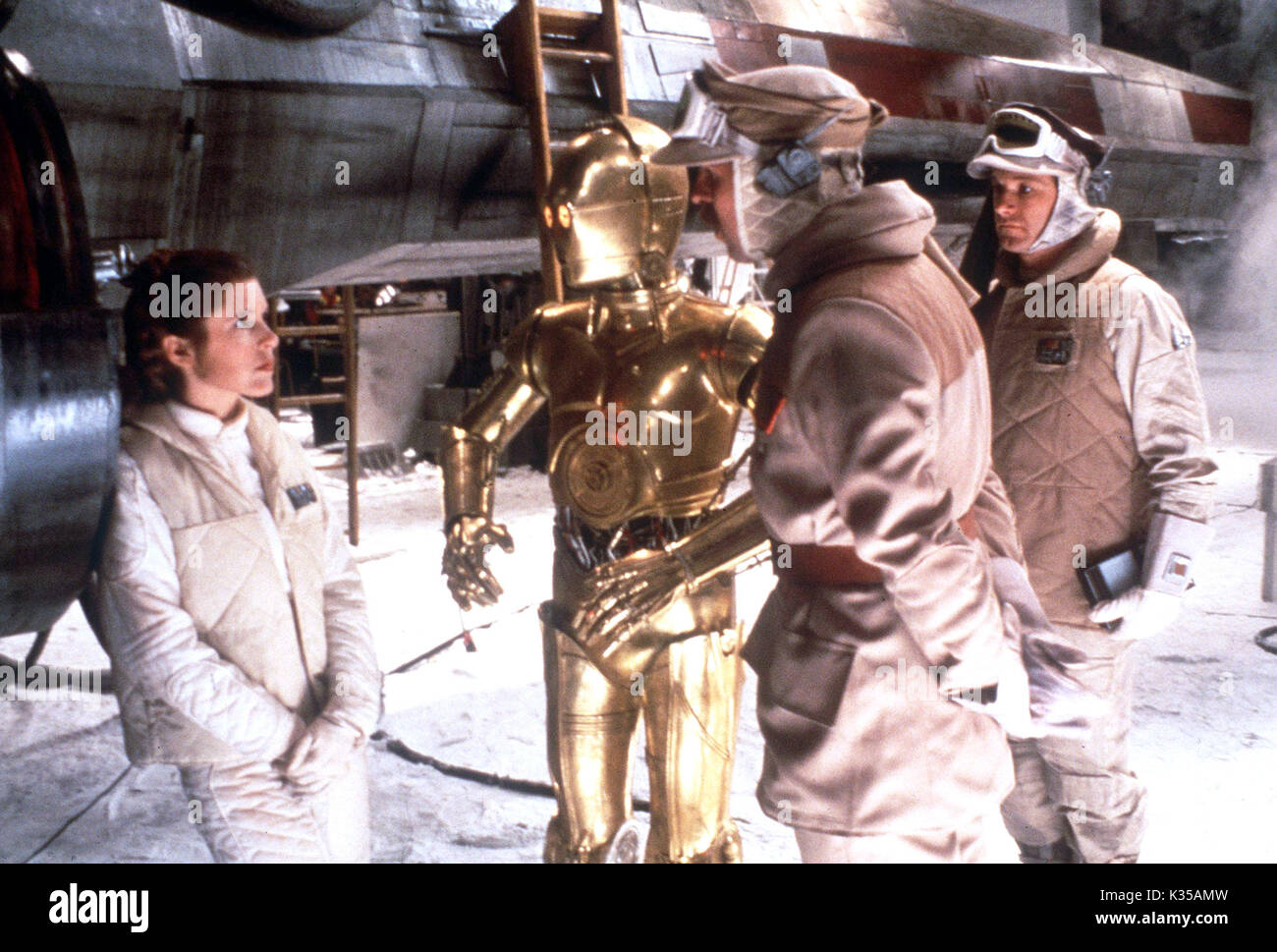 Photo Must Be Credited ©Supplied by Alpha 070000 (1980) Carrie Fisher as Princess Leia and Anthony Daniels as C-3PO in Star Wars The Empire Strikes Back movie Stock Photo