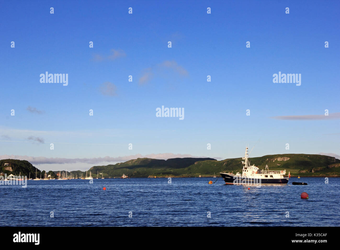 Cruise ship Elizabeth-G anchored in Oban Bay, early on a summer morning, Scotland Stock Photo