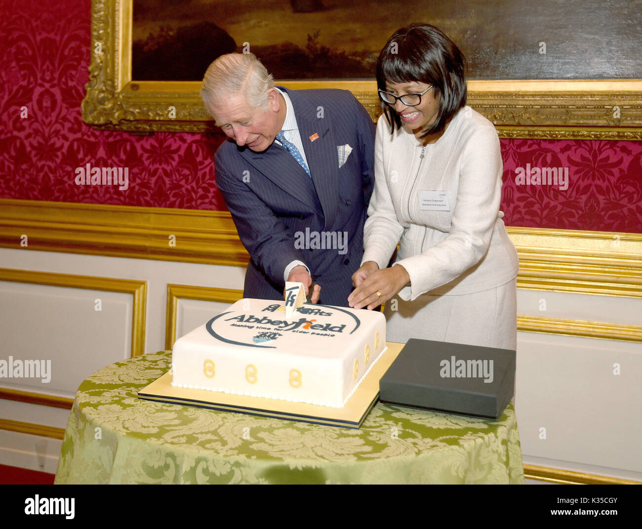 Britain's Prince Charles cuts a birthday cake during a visit to News  Photo - Getty Images