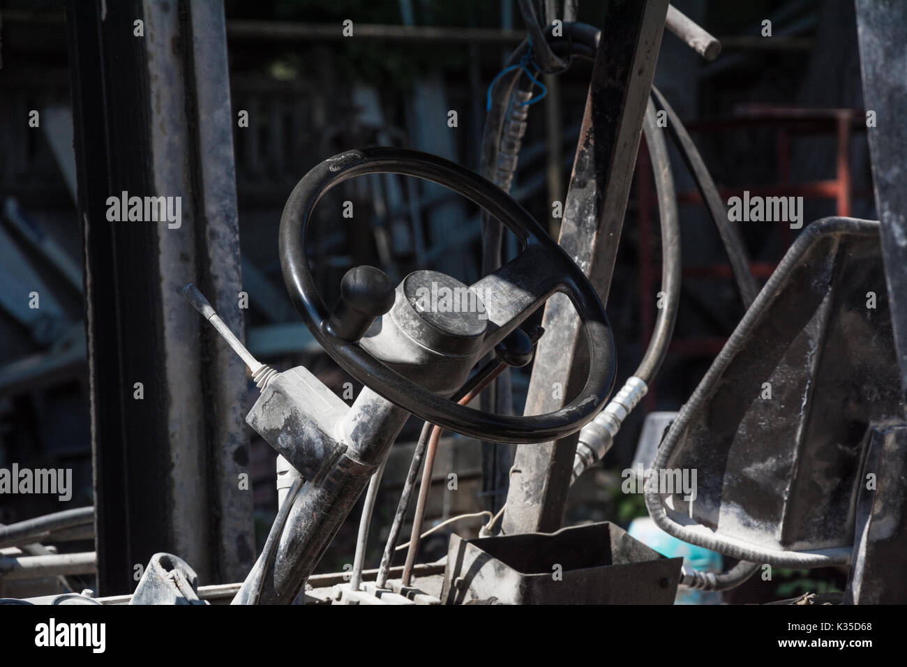 Steering wheel of old forklift truck Stock Photo