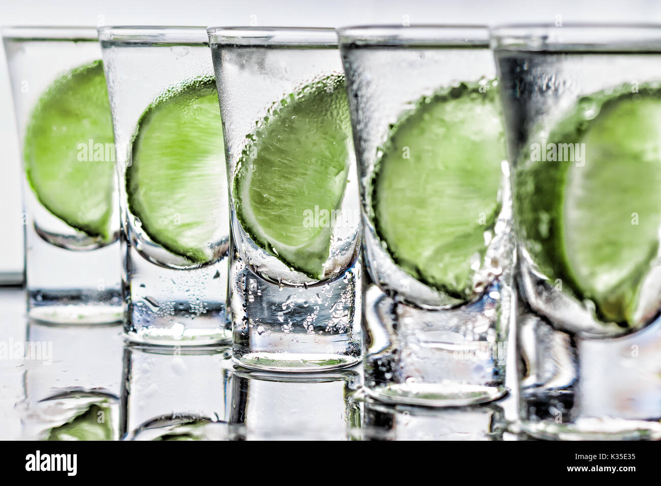 Cocktail. Vodka, gin, tequila with lime Stock Photo Alamy