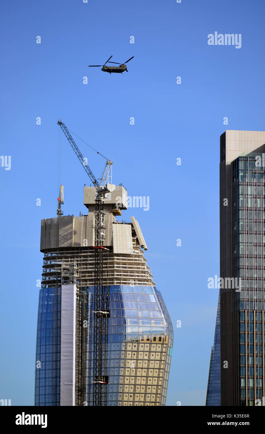 United Kingdom, London, One Blackfriars under Construction with Chinook Helicopter Stock Photo
