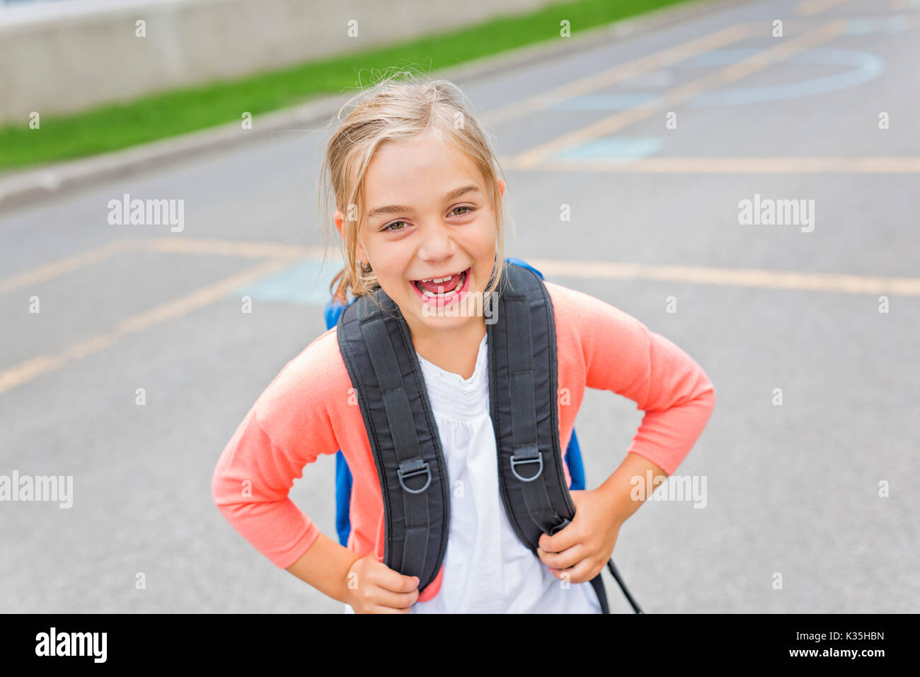 A eight years old school girl close to the schoolyards Stock Photo - Alamy
