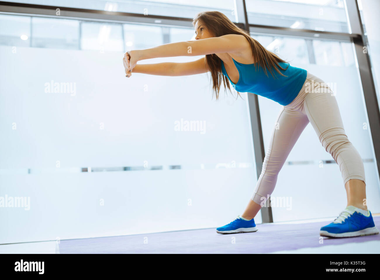 Beautiful woman stretching and exercising Stock Photo