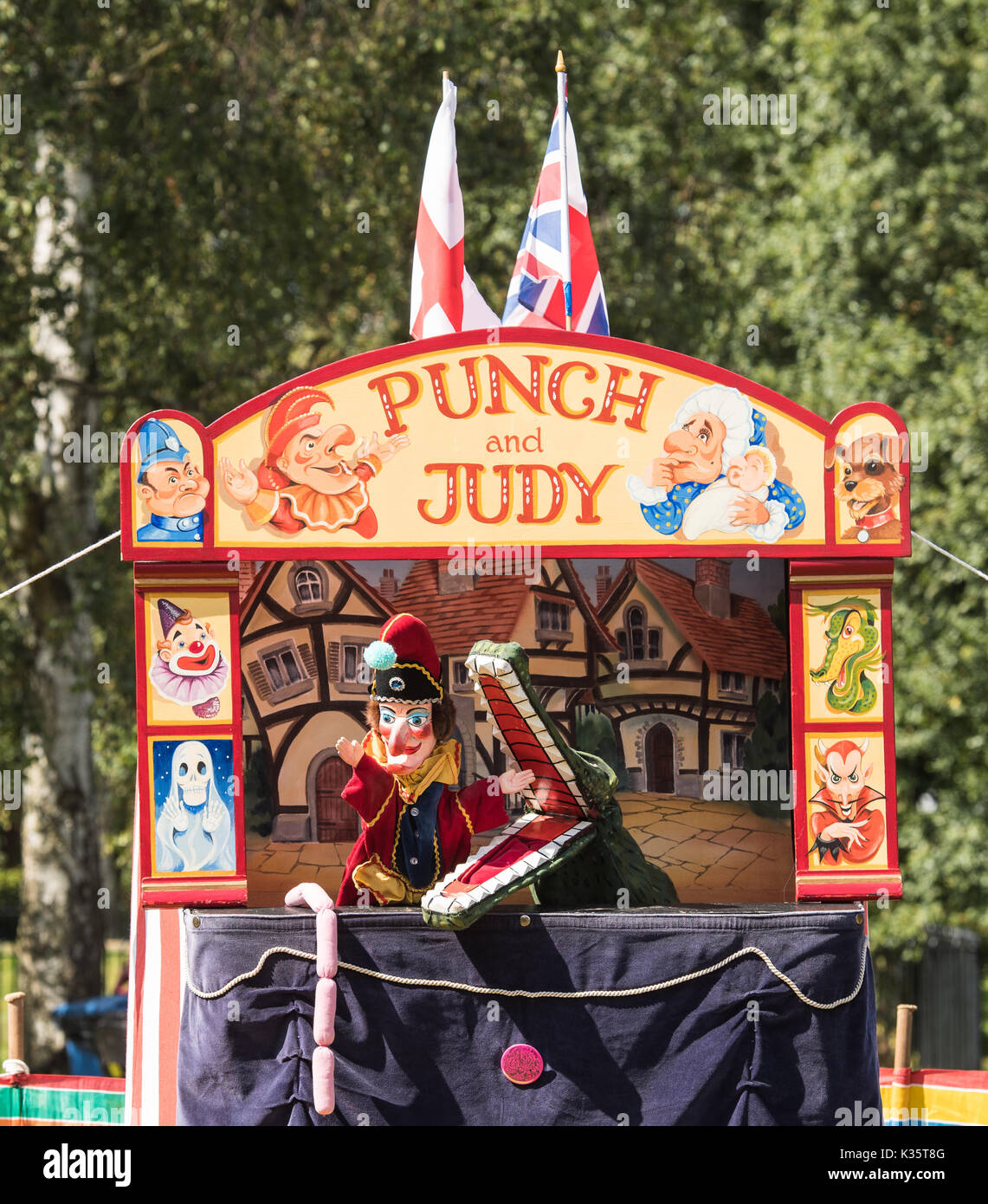 a traditional Punch and Judy show by David Wilde in an English park in the summer at Brentwood, Essex with the Mr Punch, Crocodile and sausages+ Stock Photo