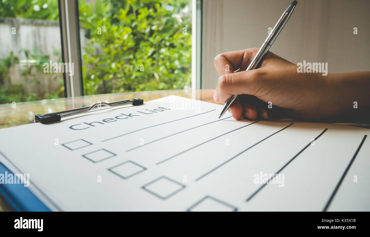 Check list hand hi-res stock photography and images - Alamy