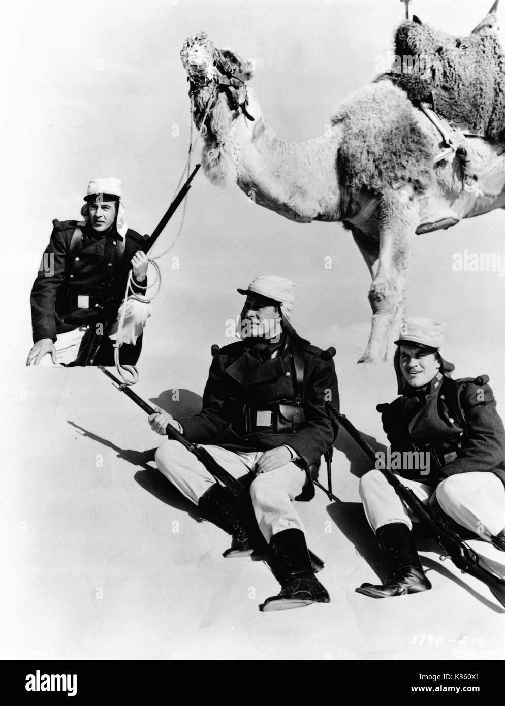 BEAU GESTE [US 1939]  L-R, GARY COOPER as Michael 'Beau' Geste, RAY MILLAND as John Geste, ROBERT PRESTON as Digby Geste Stock Photo