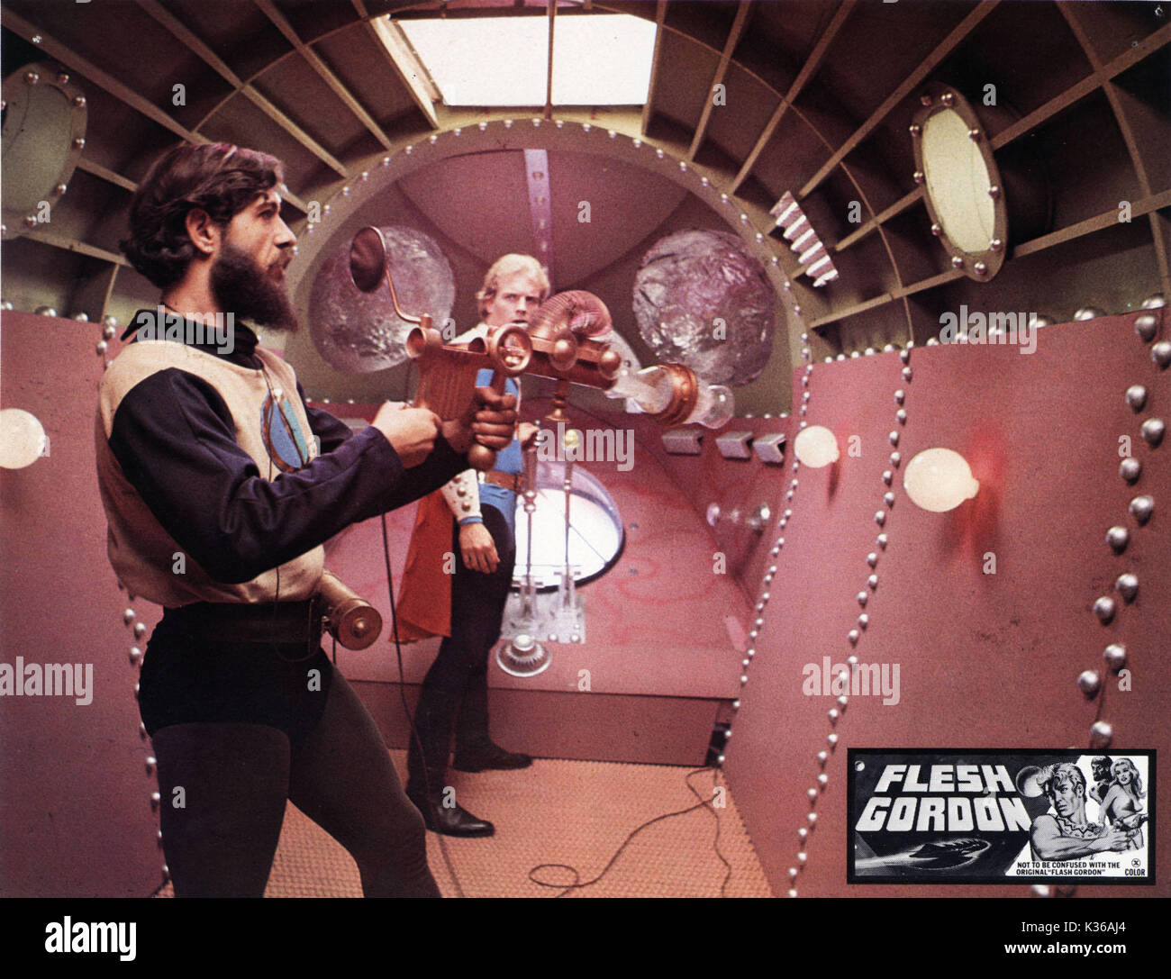 FLESH GORDON JOSEPH HUDGINS AS DR FLEXI JERKOFF AND JASON WILLIAMS AS FLESH  GORDON RAYGUN A GRAFFITI PRODUCTION Date: 1974 Stock Photo - Alamy