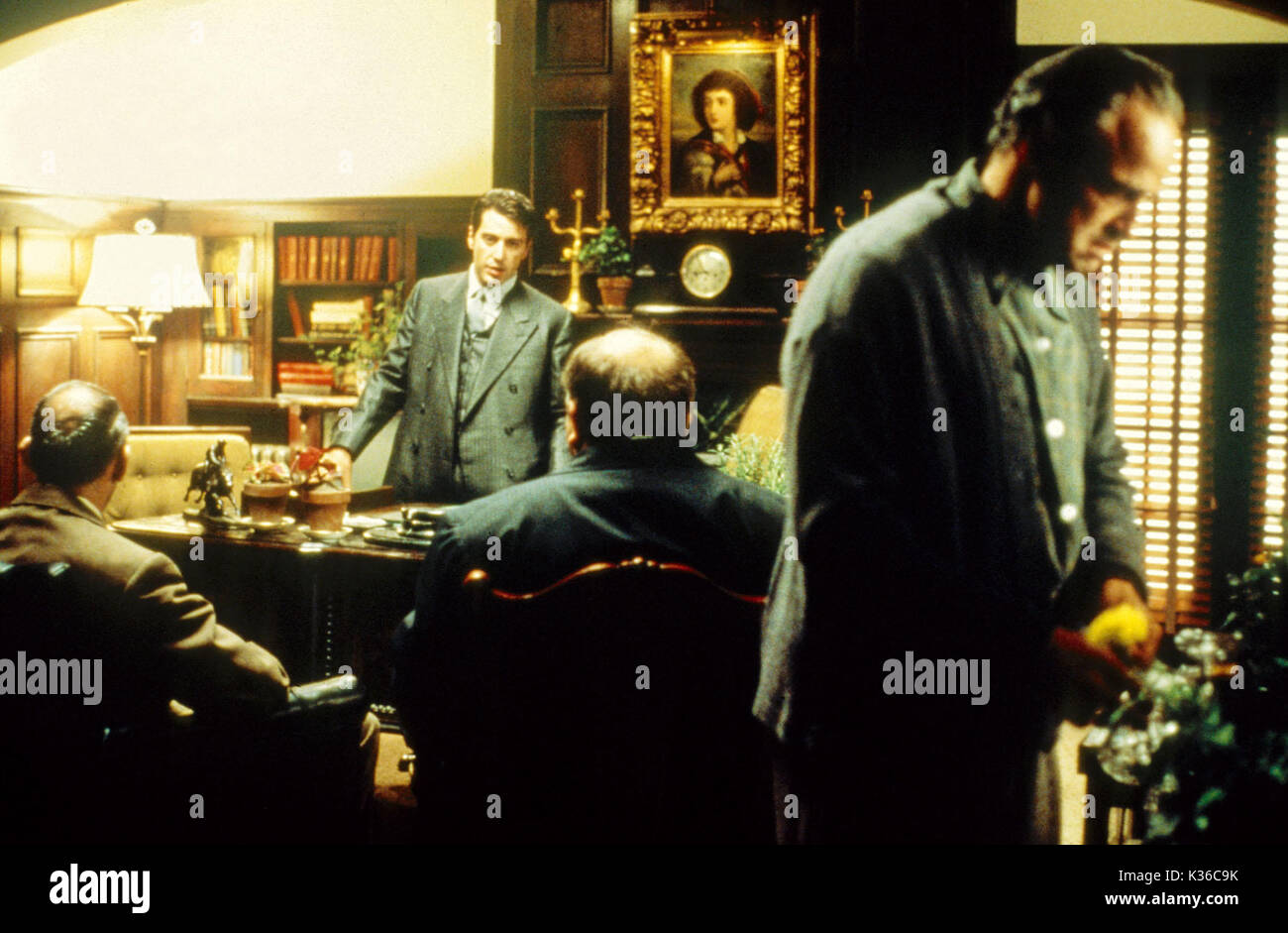 THE GODFATHER ABE VIGODA , AL PACINO as Micheal Corleone, RICHARD CASTELLANO [back to camera] MARLON BRANDO as Vito Corleone     Date: 1972 Stock Photo