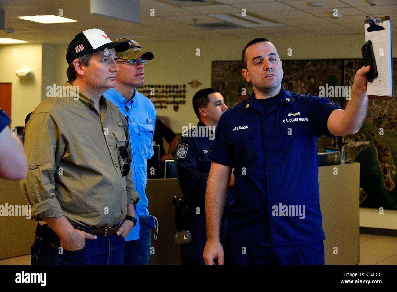 Houston, United States. 31st Aug, 2017. U.S. Senator Ted Cruz of Texas is briefed by Coast Guard crew members during a visit to Sector Houston-Galveston operations center in the aftermath of Hurricane Harvey August 31, 2017 in Houston, Texas. Credit: Planetpix/Alamy Live News Stock Photo