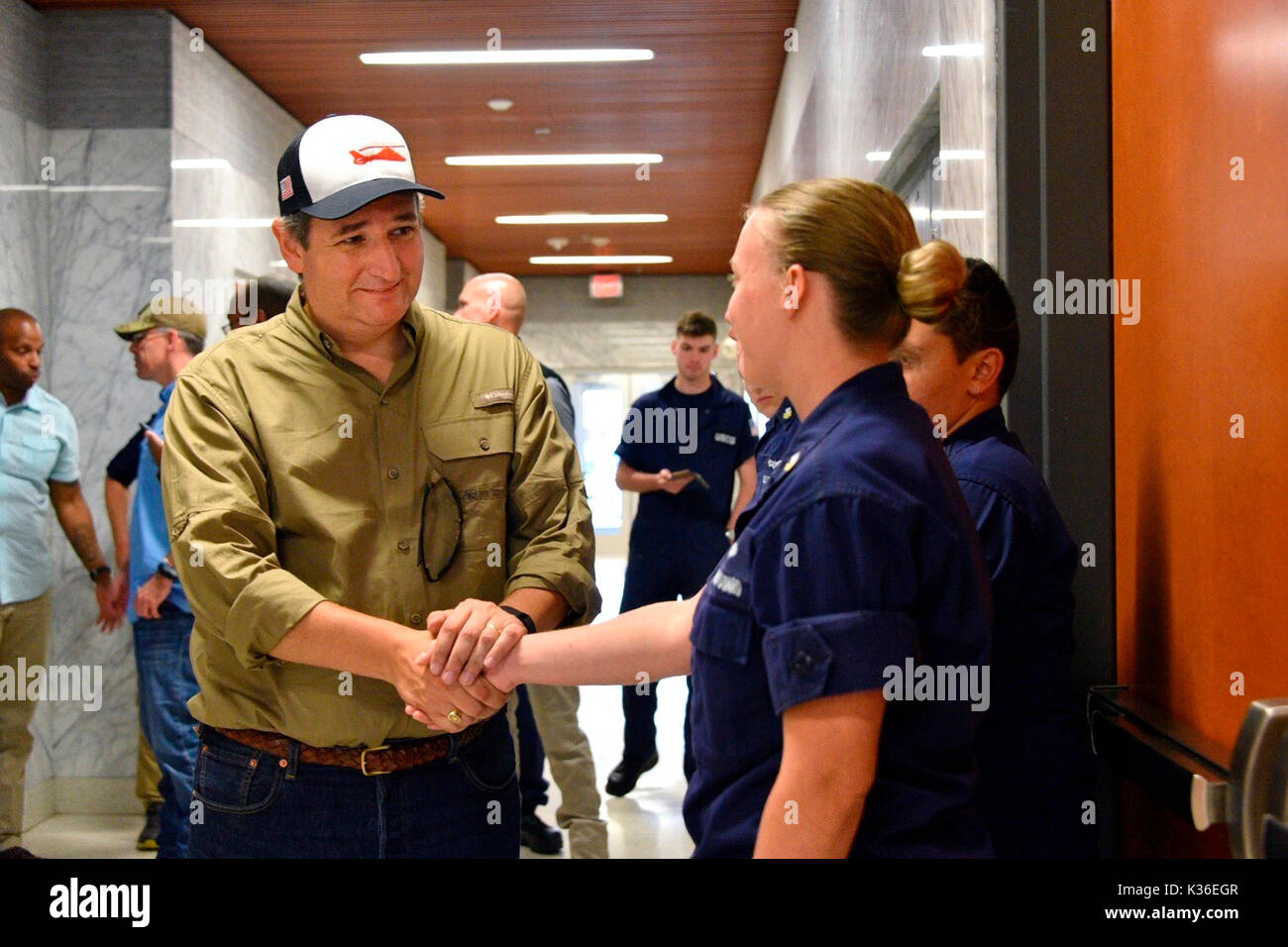 Houston, United States. 31st Aug, 2017. U.S. Senator Ted Cruz of Texas thanks a Coast Guard crew member during a visit to Sector Houston-Galveston operations center in the aftermath of Hurricane Harvey August 31, 2017 in Houston, Texas. Credit: Planetpix/Alamy Live News Stock Photo
