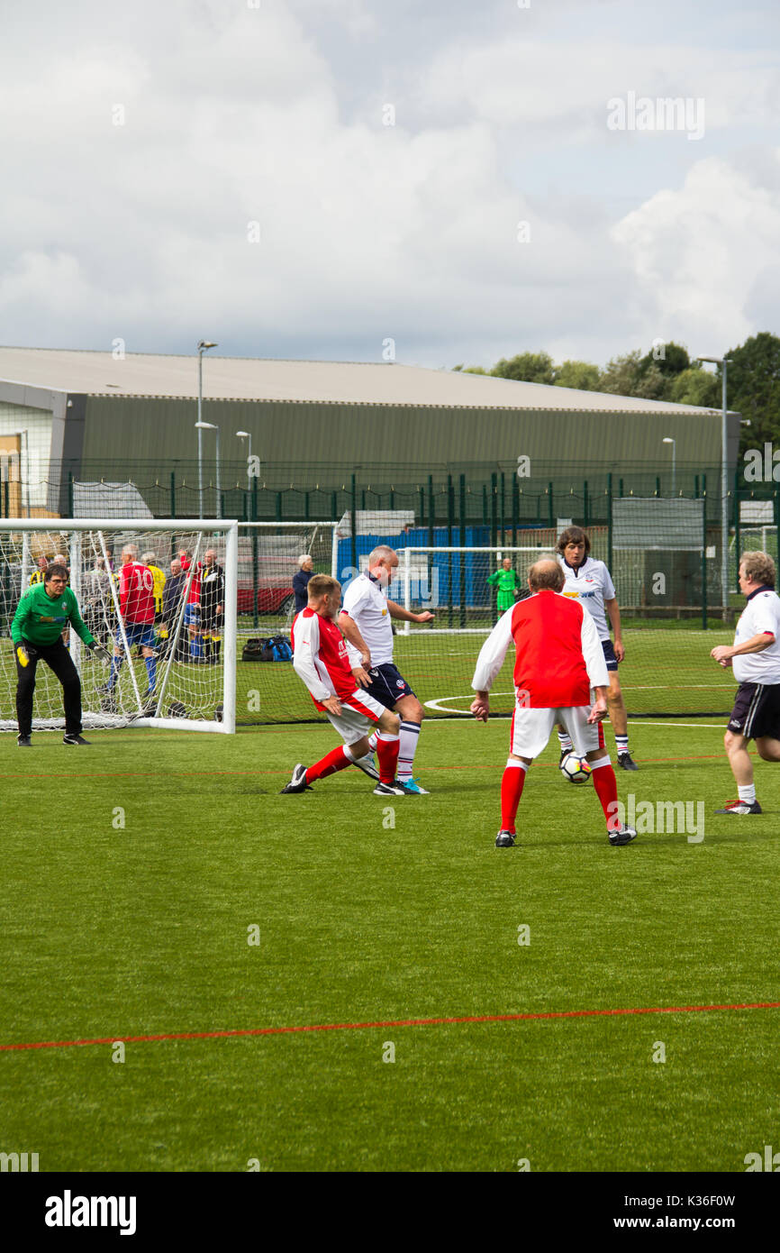 Heywood, Greater Manchester, UK. 1st Sep, 2017. Today saw the kick-off of the second season for the Greater Manchester Over 60s Walking Football league at Heywood Sports Centre. Bolton Wanderers A, in white, defend an attack from Fleetwood Town Flyers while playing out a goalless draw. Walking Football is one of the fastest growing areas of organised football in the UK, aimed at increasing health and fitness through physical activity in the over 50s, encouraged by football clubs, health professionals and the Football Association. Credit: Joseph Clemson 1/Alamy Live News Stock Photo