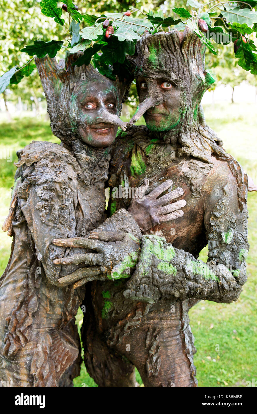 GEEK ART - Bodypainting meets SciFi, Fantasy and more: Fairytale photoshooting with model Maria and Enrico as tree-beings in the monastery garden of the monastery church Wittenburg on August 30, 2017  - A project of the photographer Tschiponnique Skupin and the bodypainter and transformaker Enrico Lein Stock Photo