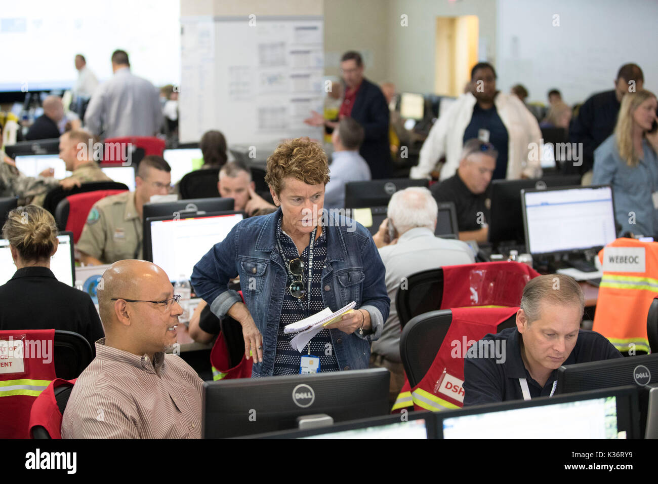 Austin, Texas USA Sept. 1, 2017: Emergency response officials and staff at the Texas Department of Public Safety Emergency Operations Center in Austin monitor the unfolding disaster of flooding in Southeast Texas from Hurricane Harvey. Credit: Bob Daemmrich/Alamy Live News Stock Photo