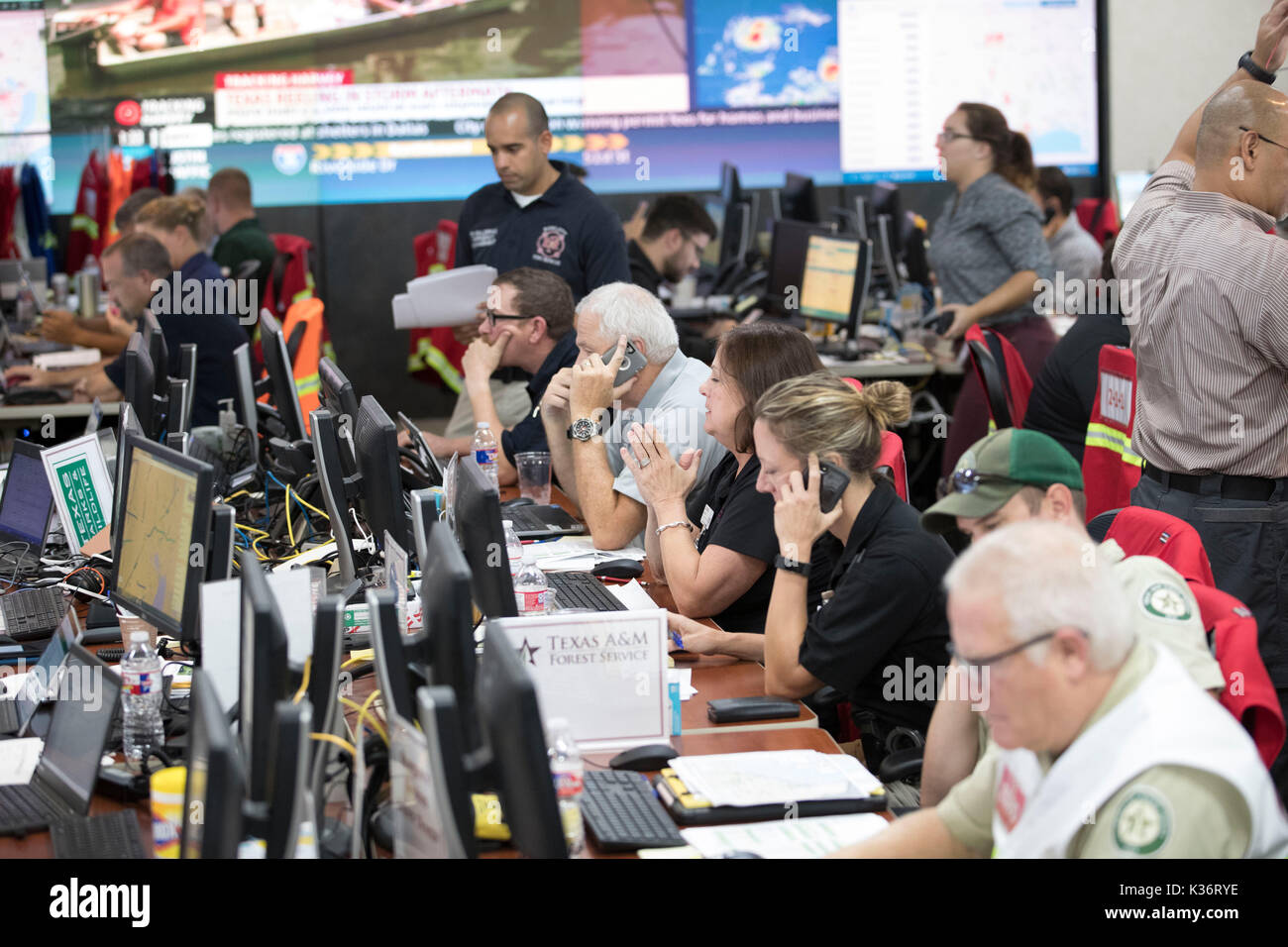 Austin, Texas USA Sept. 1, 2017: Emergency response officials and staff at the Texas Department of Public Safety Emergency Operations Center in Austin monitor the unfolding disaster of flooding in Southeast Texas from Hurricane Harvey. Credit: Bob Daemmrich/Alamy Live News Stock Photo