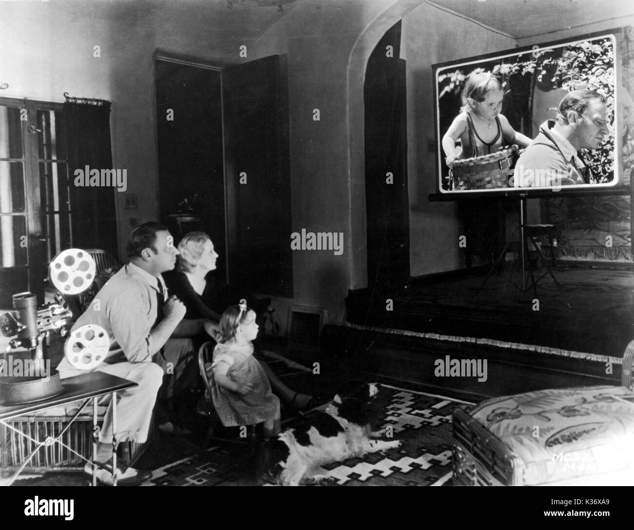 WALLACE, RITA AND CAROL ANN BEERY WATCHING HOME MOVIES Stock Photo