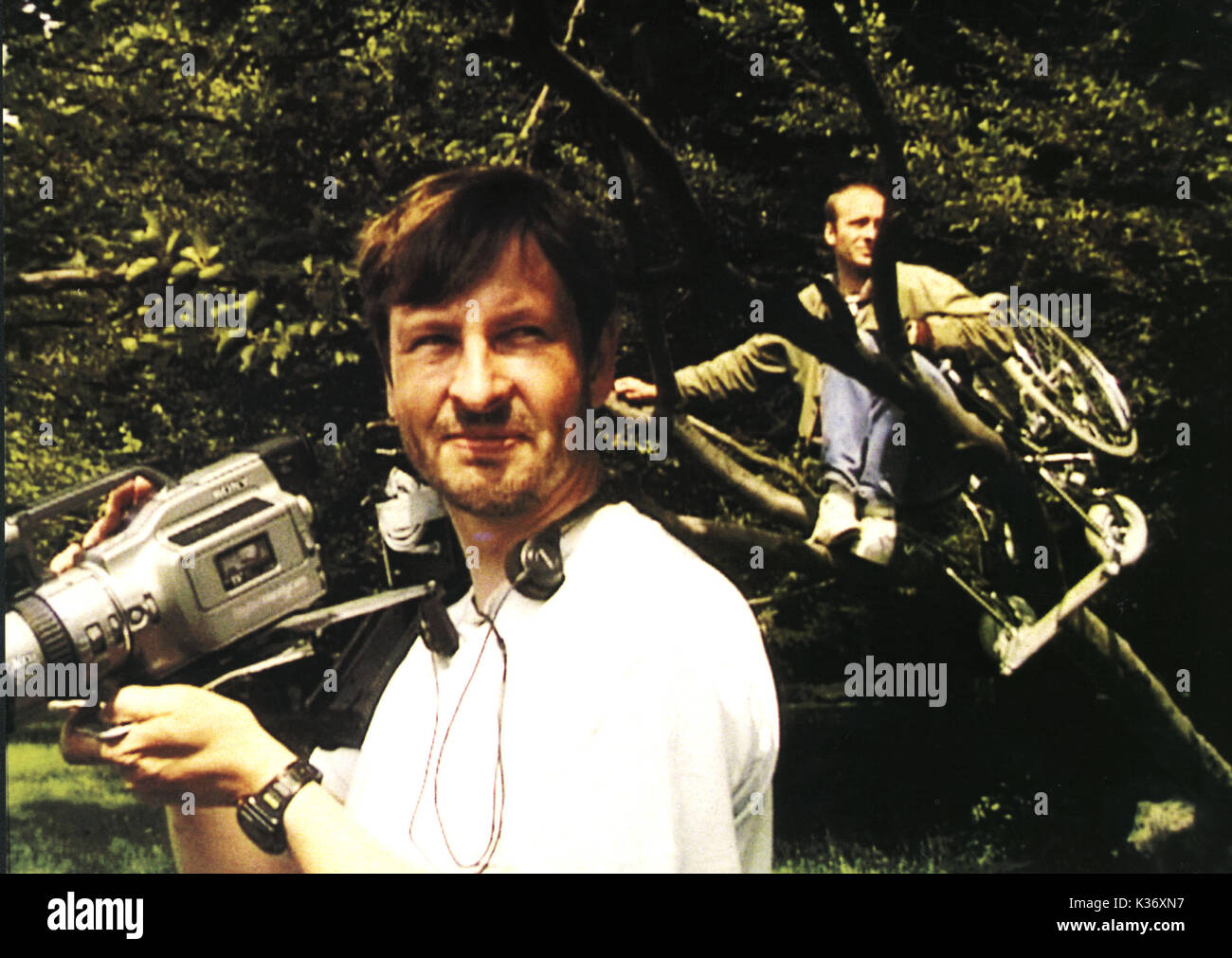 THE IDIOTS Also Known As: Dogme # 2 - Idioterne DIRECTOR, LARS VON TRIER HENRIK PRIP, IN TREE Stock Photo