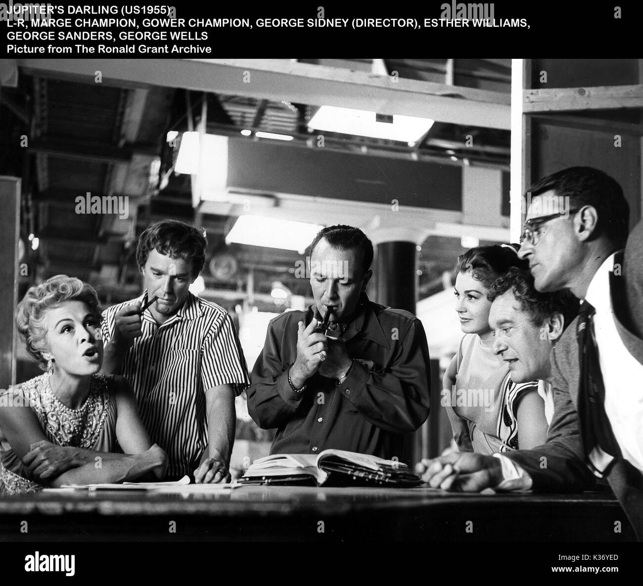 JUPITER'S DARLING [US 1955]  L-R, MARGE CHAMPION, GOWER CHANPION, director GEORGE SIDNEY, ESTHER WILLIAMS, GEORGE SANDERS, GEORGE WELLS Stock Photo